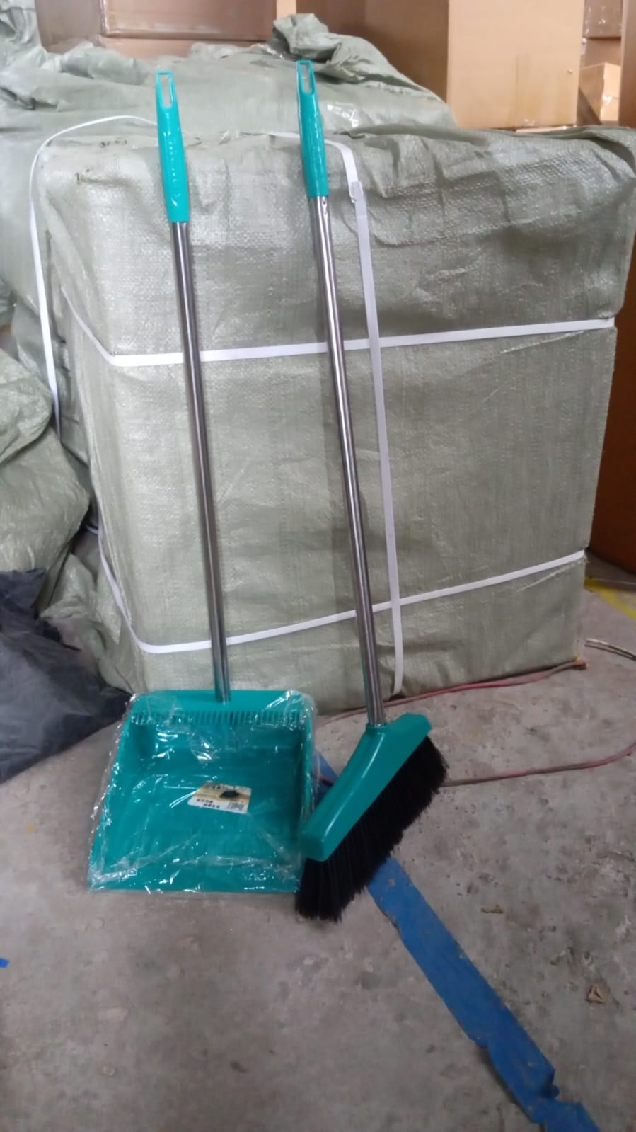 Dustpan and brush with long handles, perfect for sweeping and cleaning large areas. Dustpan and brush with long handles, perfect for sweeping and cleaning large areas.